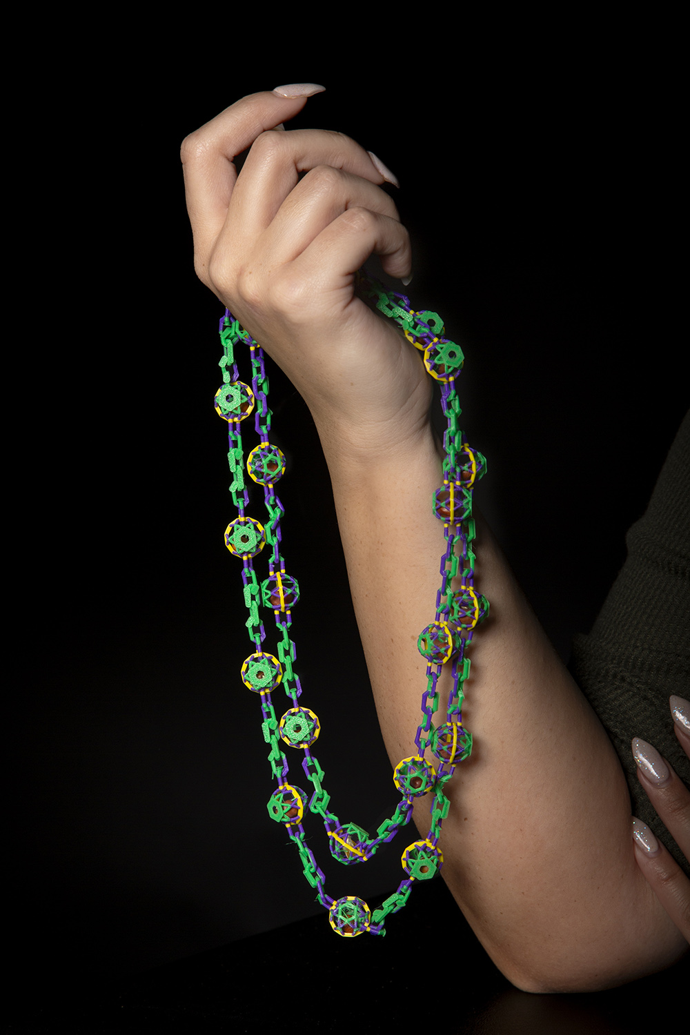 Woman's hand holding biodegradable beads