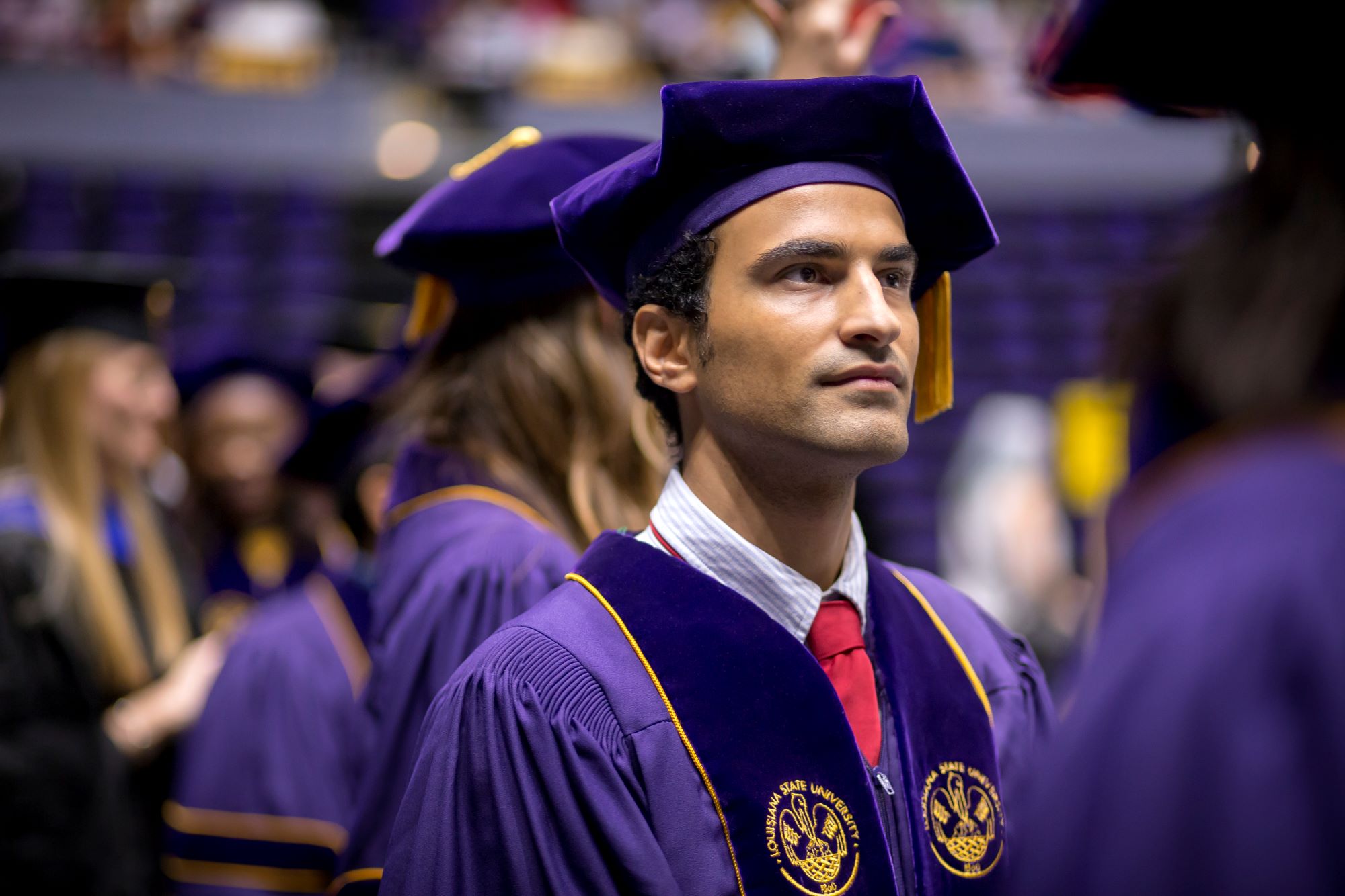 person in full LSU graduation regalia