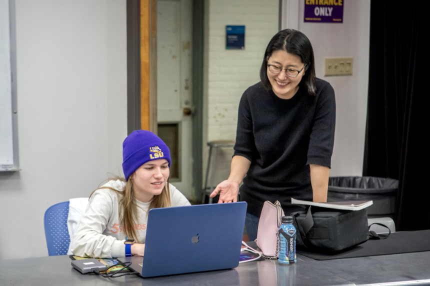 professor talks with student