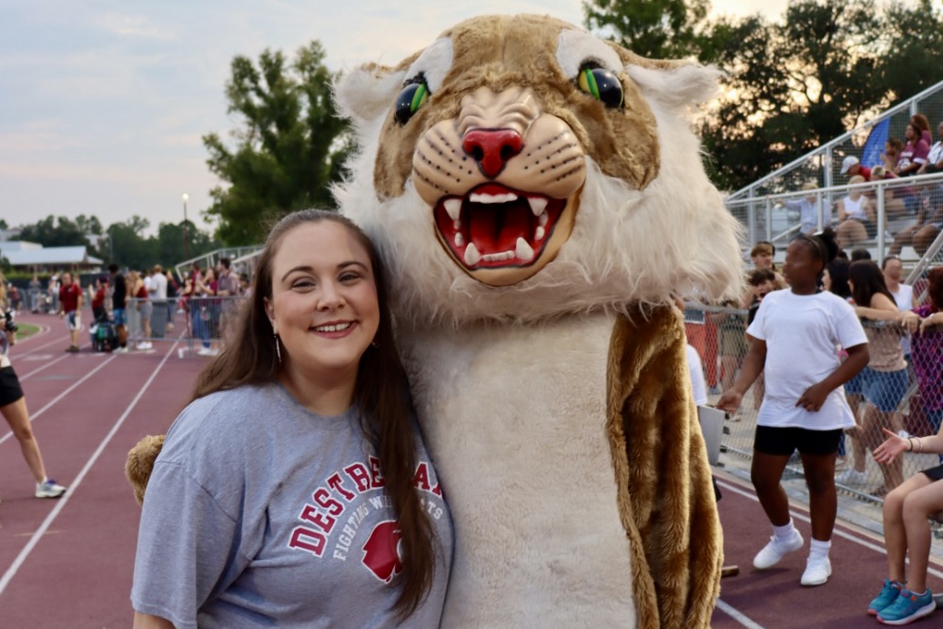 Macy with Destrehan high school mascot