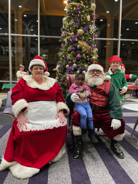 Santa Claus and Mrs. Claus with children