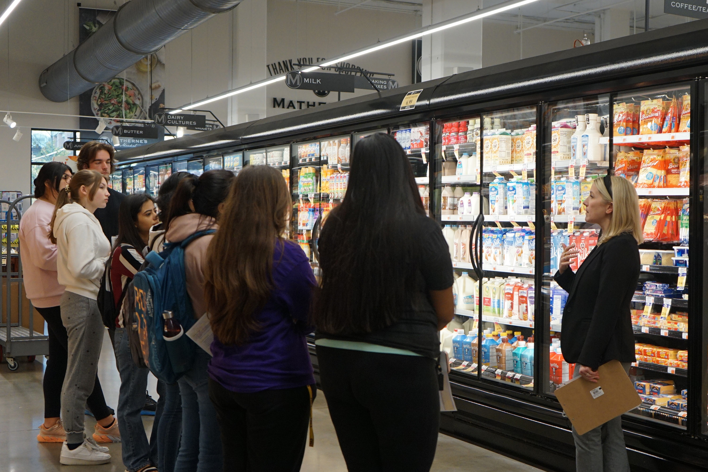 people shopping at the grocery store