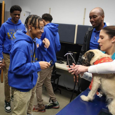 Student performing heart ascultation at an outreach event